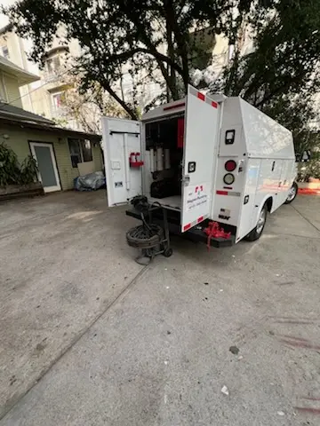 Magnet Plumbing service vehicle on-site for Grease Trap Cleaning in Geiger Heights